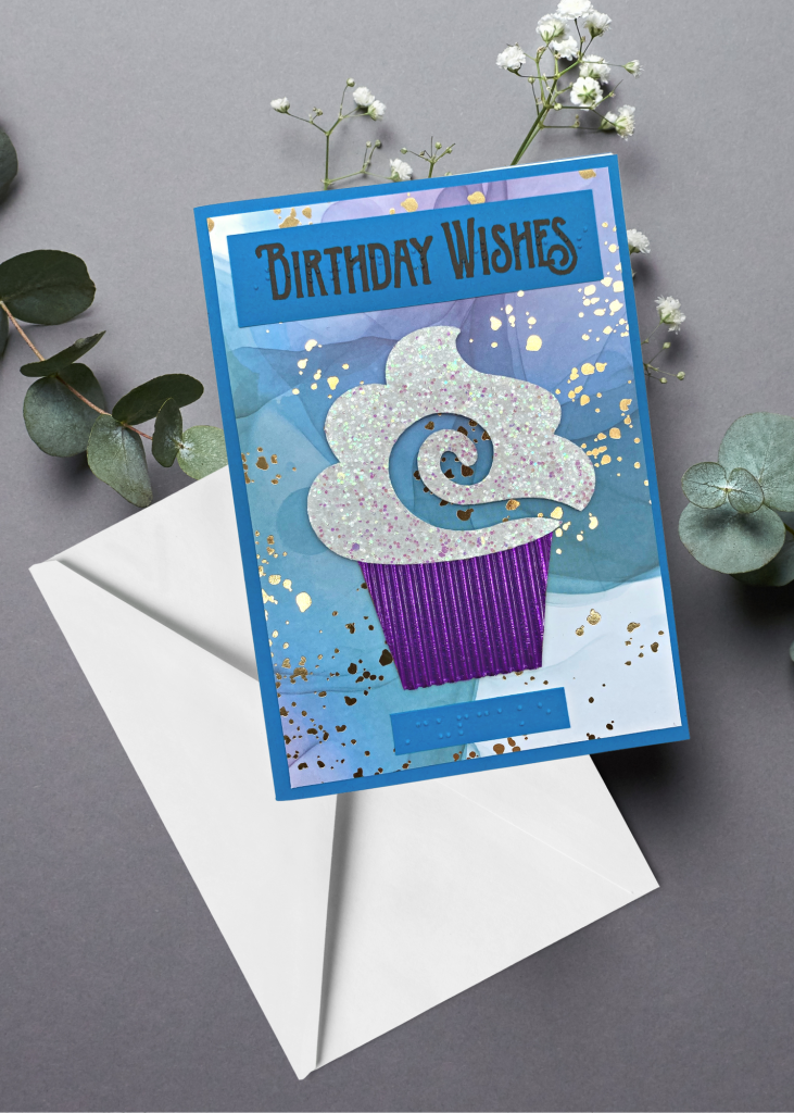 the birthday wishes card sitting with a white envelope on a neutral grey backdrop