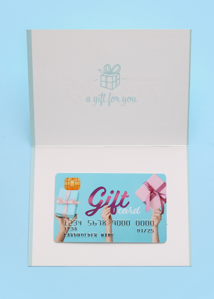 an image of a gift card with braille sticker label 